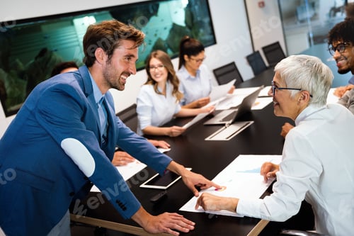 Preview: Group of multiethnic business people working at busy modern office
