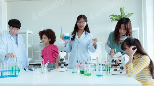 Preview: In the science classroom, an Asian child scientist experimenting with scientific formulas