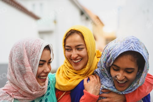 Preview: Happy Muslim women walking in the city center
