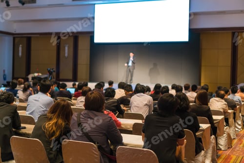 Preview: Rear side of Audiences sitting and listening the speackers on the stage in low light conference hall