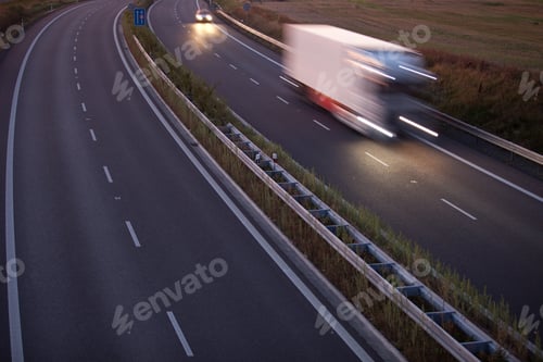 Preview: highway traffic - motion blurred truck on a highway/motorway/spe