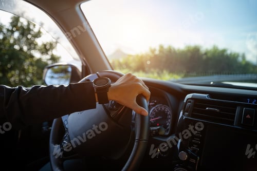 Preview: people driving car on mountain road