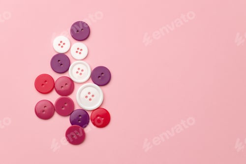 Preview: Plastic buttons on pink pastel background top view
