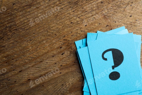 Preview: Blue paper cards with question mark on wooden background, top view. Space for text