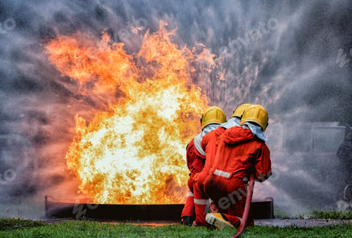 Preview: fire fighter team on training with gas and oil fire hold hose spray jet water spray to extinguish