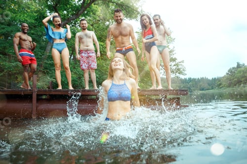 Preview: Enjoying river party with friends. Group of beautiful happy young people at the river together