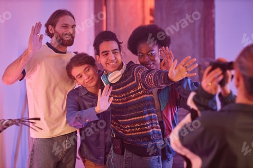 Preview: Diverse group of friends having fun at house party and filming home video