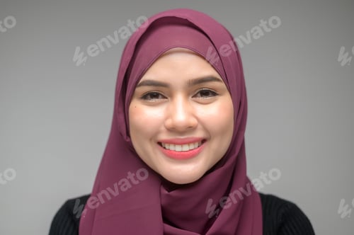 Preview: portrait of young muslim woman over white background studio
