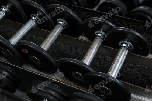 Preview: Different black dumbbells in the modern gym