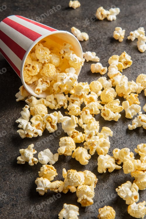 Preview: Sweet tasty popcorn in striped paper cup.