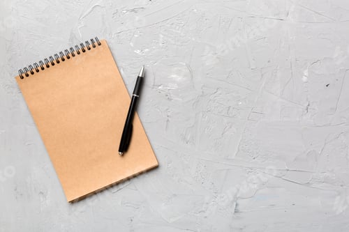 Preview: school brown notebook on a colored background, spiral craft notepad on a table Top view