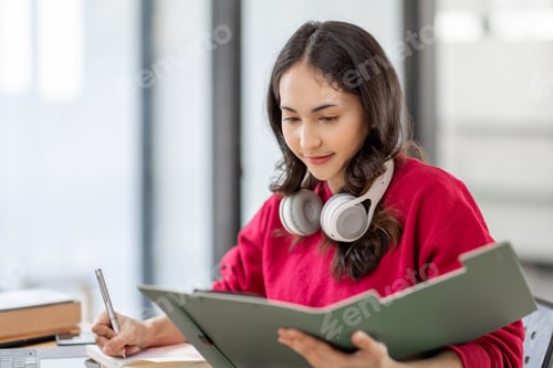 Preview: Shot of a asian young business Female working on laptop computer in her workstation.Portrait of