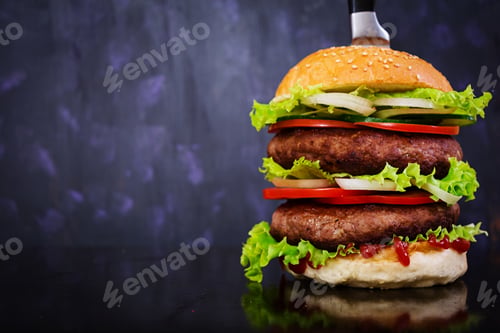 Preview: Delicious handmade burger on dark background. Close view