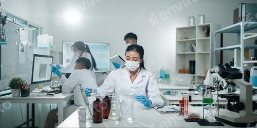 Preview: Medical research teamwork in laboratory using microscope and blood test tubes for DNA analysis