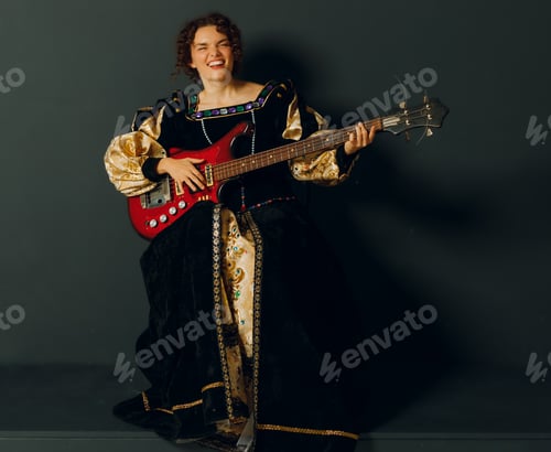 Preview: Portrait of a young adult woman playing classical music on electric guitar in a medieval dress.