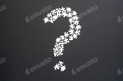 Preview: closeup puzze question mark on dark background isolated b