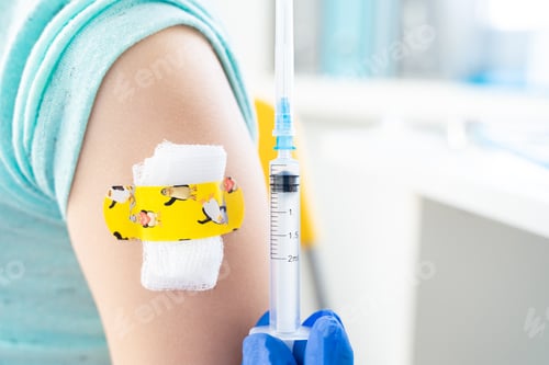 Preview: Vaccination of little girl in doctor's office. Kids funny adhesive plaster,gauze napkin.Syringe with