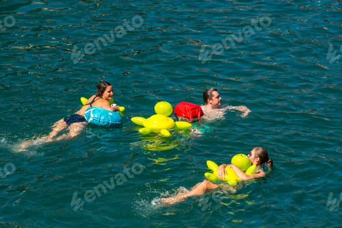 Preview: People have fun participating the swimming summer festival