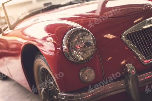 Preview: Close up headlight of red Retro classic car