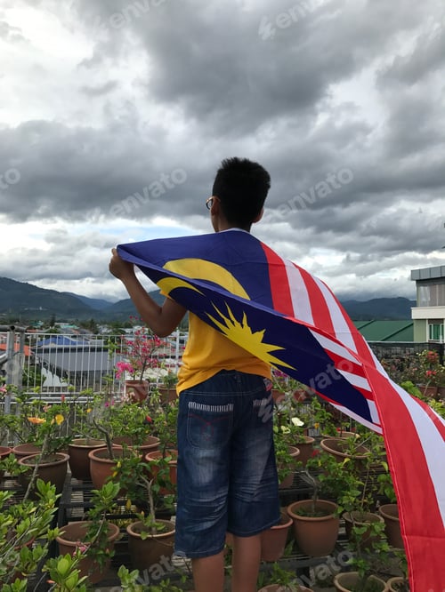 Preview: Teen with Flag Looking at View from Balcony
