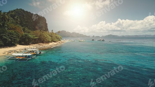 Preview: Aerial sun beach at ocean bay pier with boats, vessels on water. Relax of tourists on tropic island