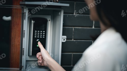 Preview: Close up hand of woman press down the finger on fingerprints scan machine for unlock door.