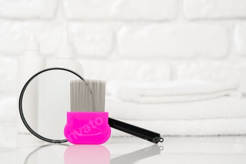 Preview: Lice treatment product next to a nit comb and magnifying glass