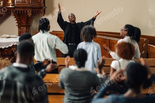 Preview: African american pastor leading congregation in prayer