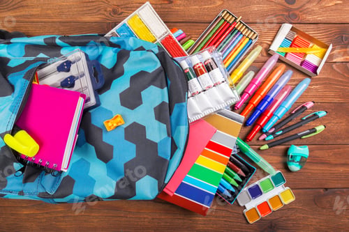 Preview: Desk cluttered with office supplies