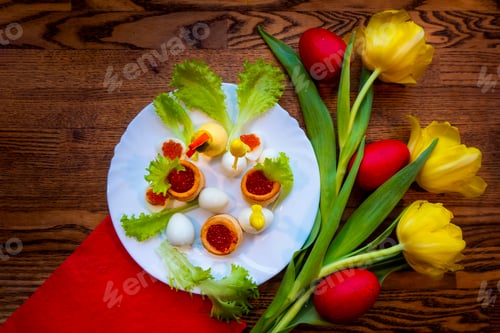 Preview: Easter holiday card with red eggs and yellow tulip flowers on wooden table