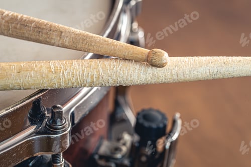 Preview: Close-up, drumsticks on a blurred background.