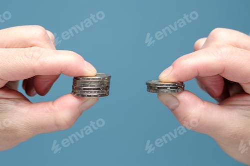 Preview: Hands are comparing two stacks of coins of different sizes, indicating worsening financial situation