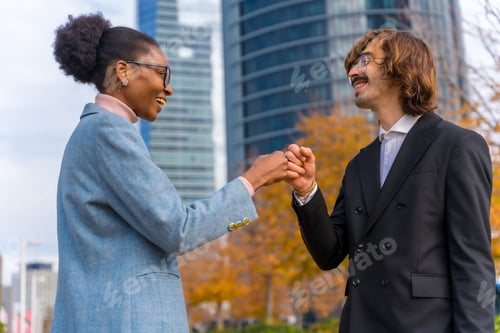 Preview: Multiethnic businessmen and businesswomen, shaking fist among colleagues, good work environment