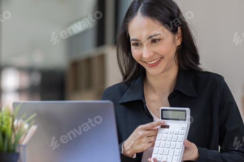 Preview: Portrait of business asian woman working on laptop in her workplace. asian smile business lady emplo