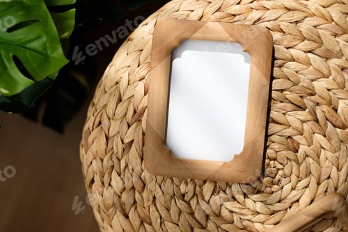 Preview: mockup wood photo frame on wicker stood with monstera with sunlight