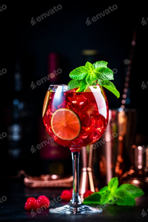Preview: Royal lemonade cocktail drink with tequila, dry gin, rum, vodka, liquor, lime, raspberries and ice
