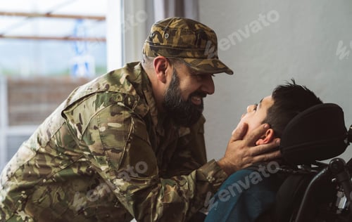 Preview: Hispanic veteran soldier caresses disabled son in a wheelchair when returning from military