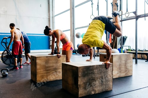Preview: People training handstands on cubes