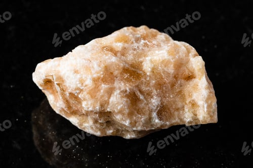 Preview: sample of uncut brown calcite rock on black