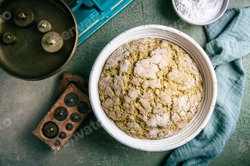 Preview: Homemade spelt bread with herbs and wild garlic, process of raising dough in a special basket