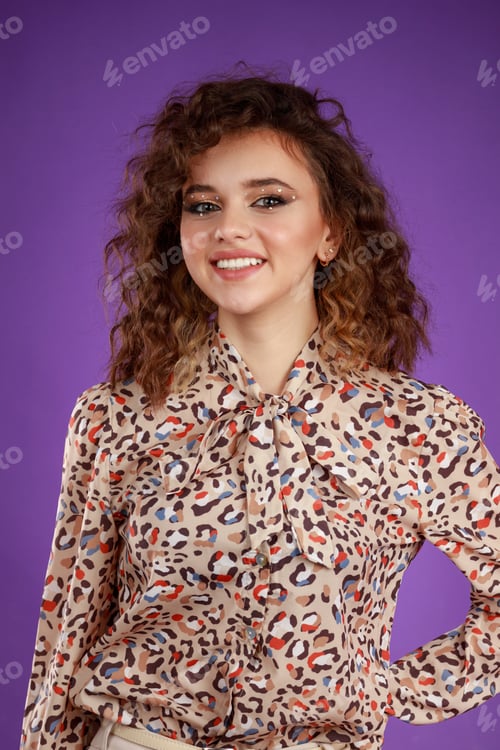 Preview: Young beautiful curly-haired girl smiling to the camera