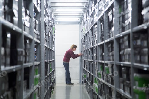 Preview: Worker searching for stock at healthcare warehouse