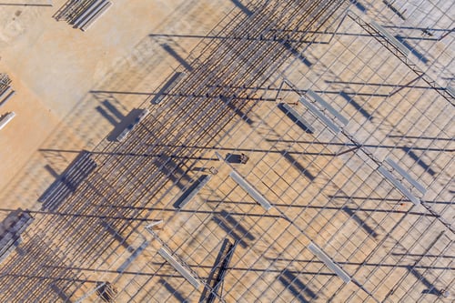 Preview: Steel structure roof truss frame is installed during building of a warehouse