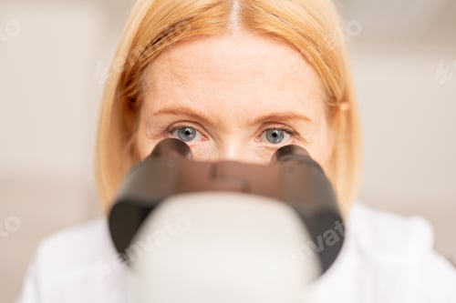 Preview: Doctor working with microscope