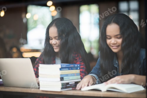Preview: Group of happy friends student talking about knowledge in cafe