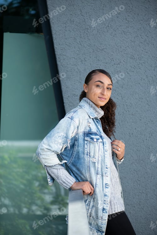 Preview: Stylish Young Woman Posing in Denim Jacket