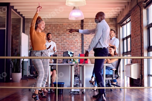 Preview: Relaxed Business Team Meeting In Busy Multi-Cultural Office With Colleagues Dancing And Having Fun