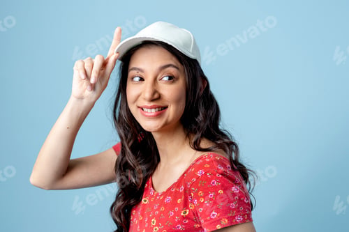 Preview: Cheerful Asian woman isolated on blue background