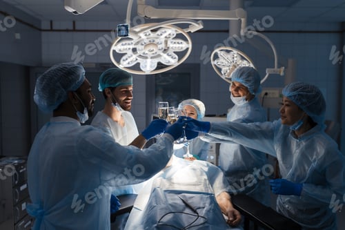 Preview: Diverse multiracial team of surgeons celebrate successful results of surgery