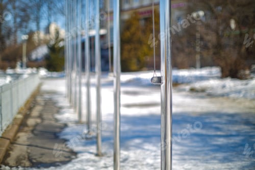 Preview: Amazing view on row of flagpoles without flags